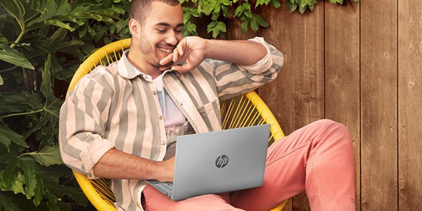 men working on HP laptop